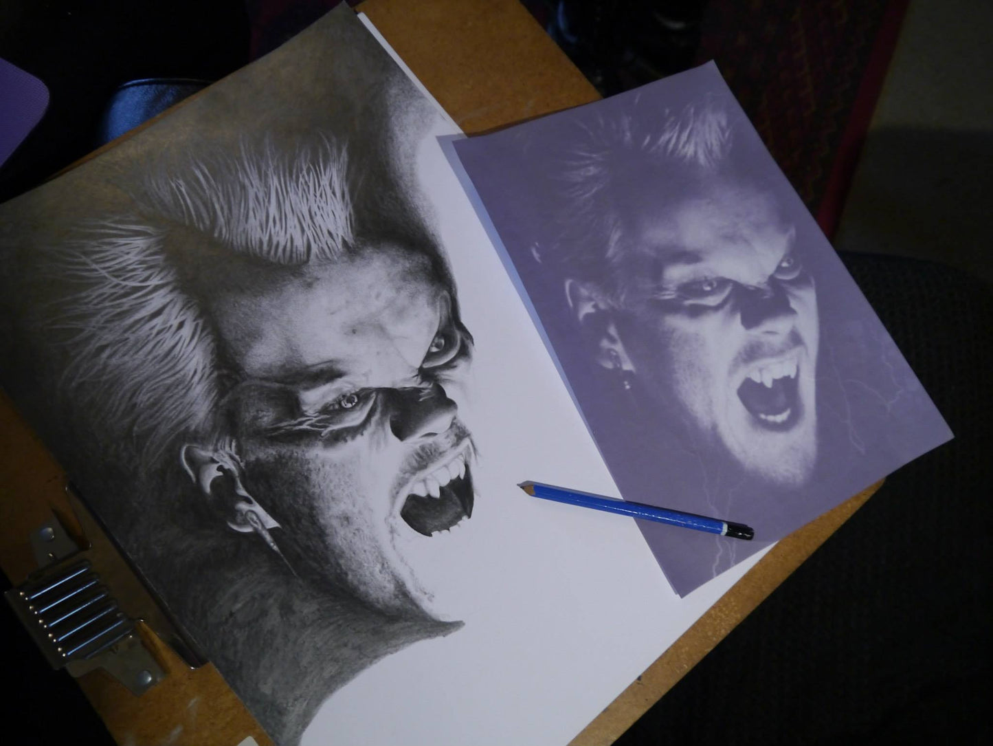 Photo showing in-progress 'Lostboys' graphite pencil drawing commission