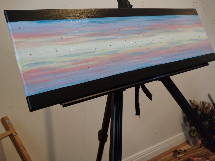 Front view photo of 'Heavenly Sky' Original acrylic on canvas painting by Kathryn Mason. Embellished with Swarovski crystals  in abstract style with pastel mid and black top and bottom stripes. 
