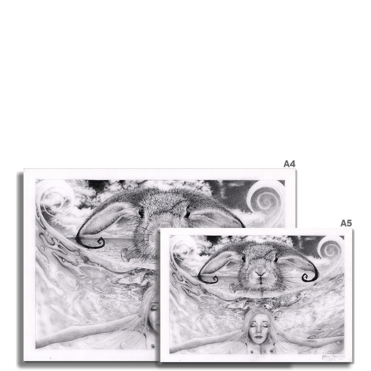 Photo showing size variations A4 and A5 available for  'Comfortably Weird' fine art print taken from Kathryn Mason's original Surrealist drawing of rabbit head floating over naked woman submerged