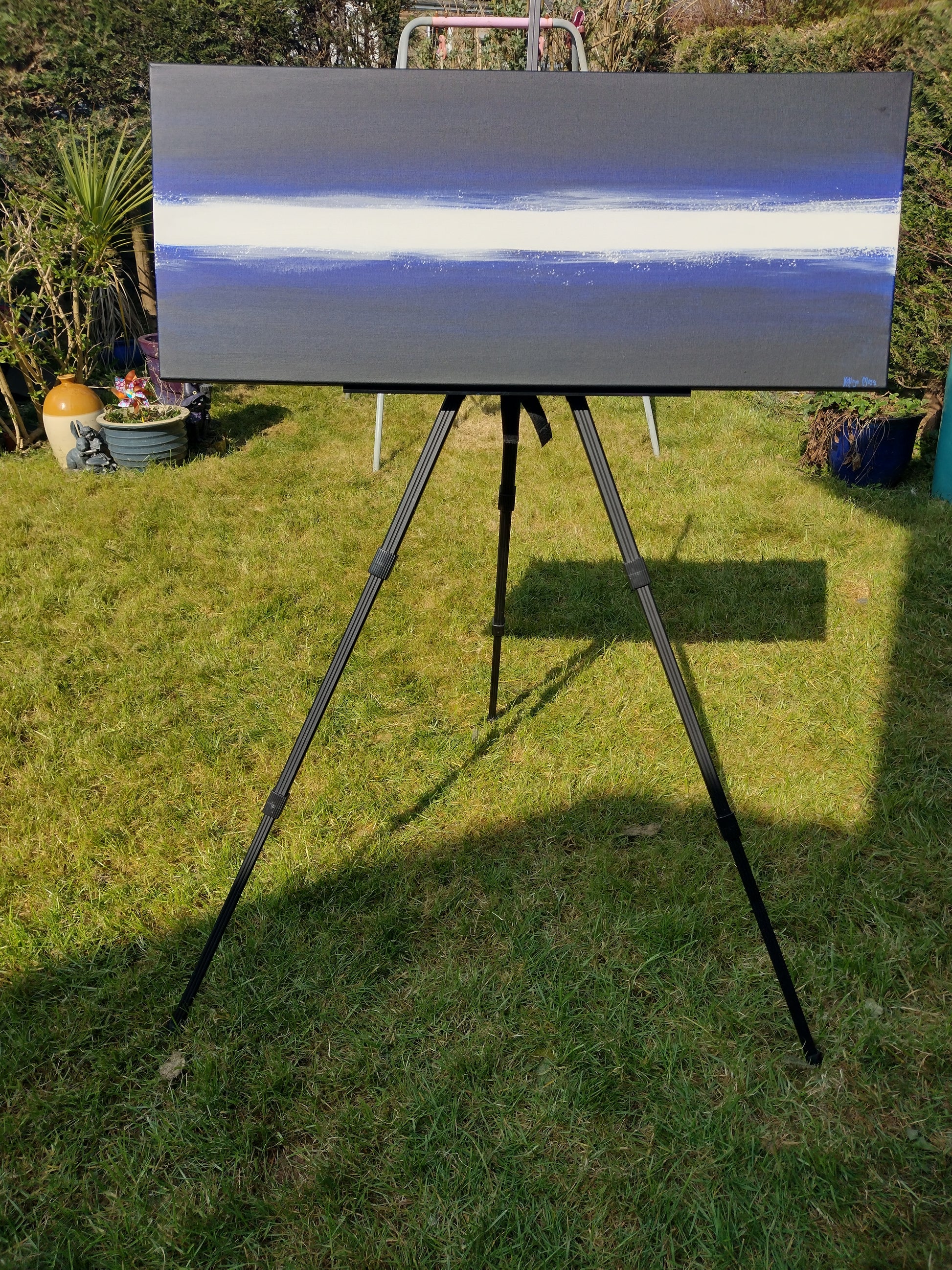 Image showing front of canvas painting 'Blues and Cocaine' Original art by Kathryn Mason, in deep blues and black with a splattered white stripe running horizontally through the centre