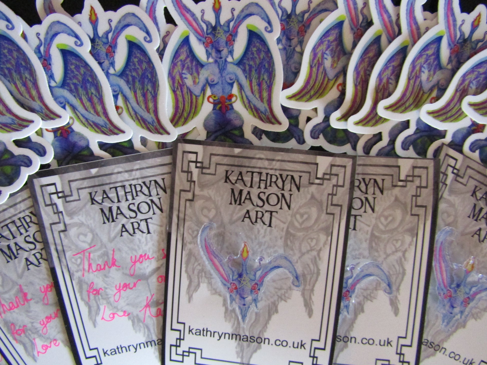 photo showing pin badge packaging and Baphomet bunny vinyl stickers