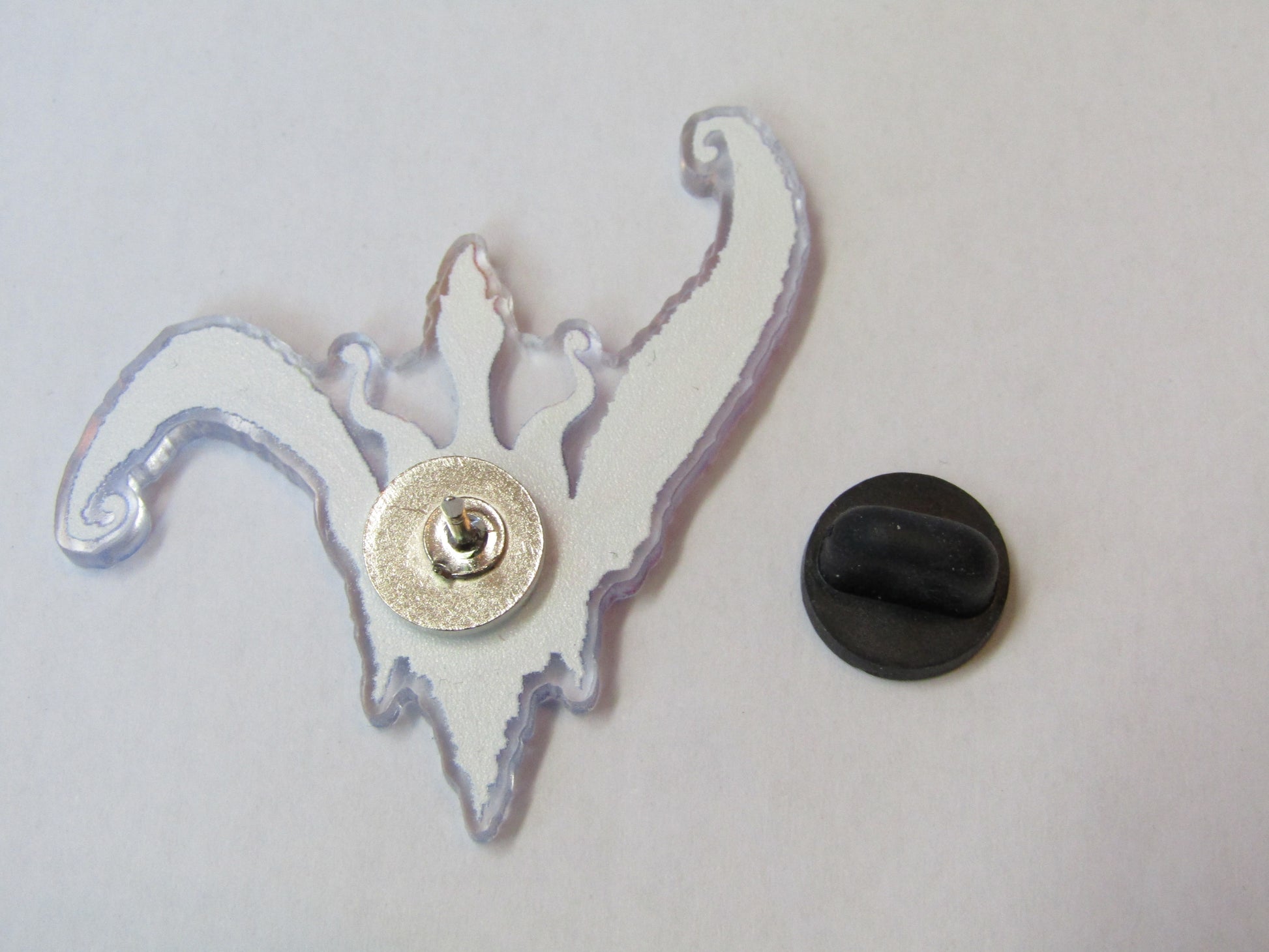 Photo showing back of pin badge 