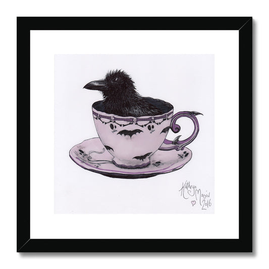 Photo showing 'Sheltering from a Storm in a Teacup' Cute Baby Crow Gothic Fine Art Print from artist Kathryn Mason's original drawing. Framed and Mounted. Shown here with black frame.